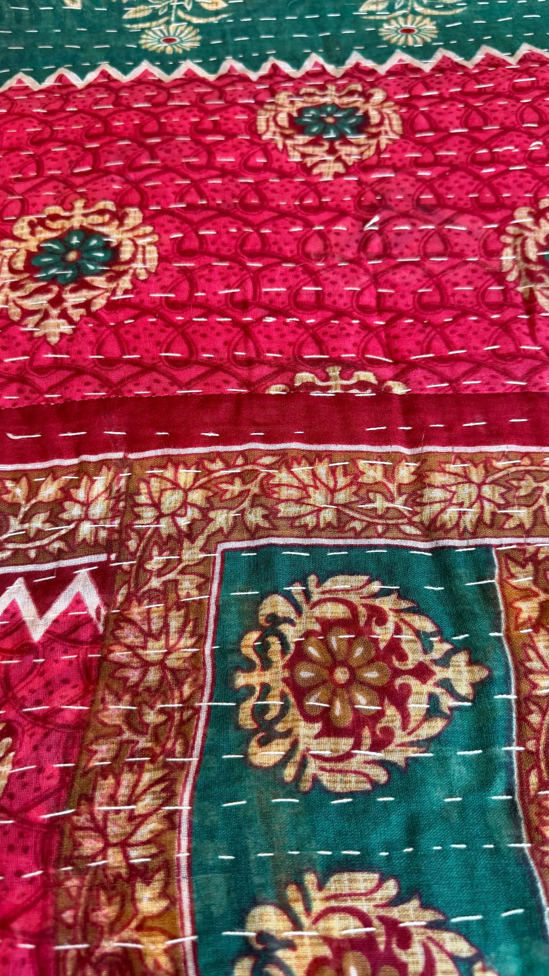 Magenta and deep teal Kantha cloth with floral roundels and zigzag borders, worked in white running stitch